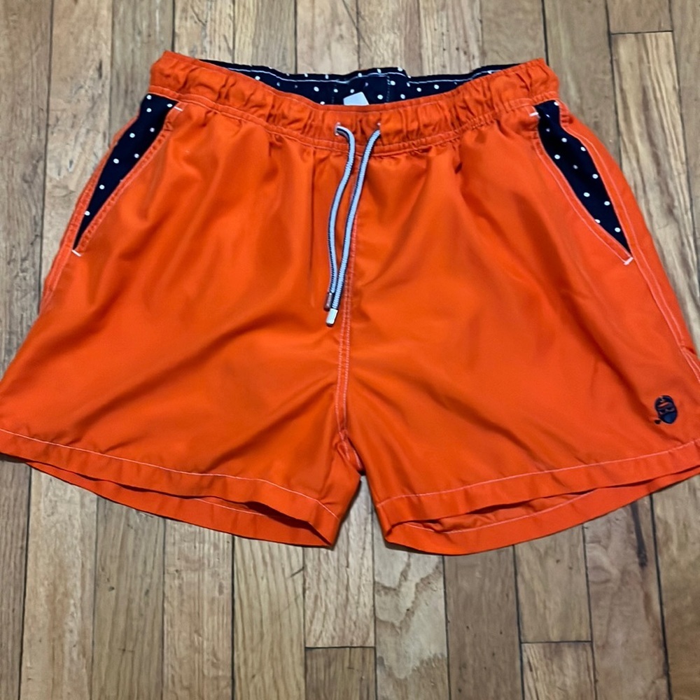 Capitan orange with blue and white polka dot swim trunks